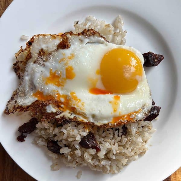 An egg on a plate of rice