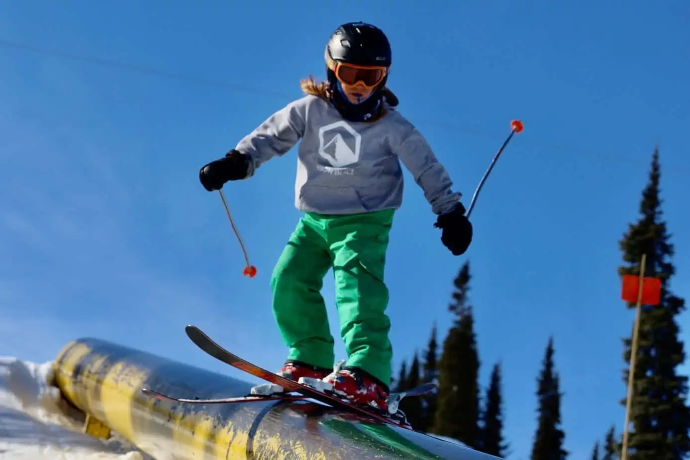 A skier riding a pipe