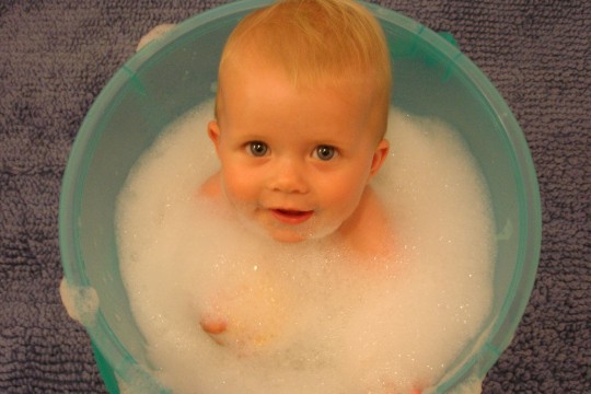 A baby in a wash tub