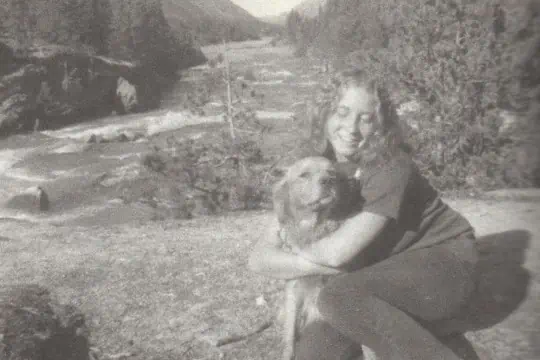 A newspaper clipping of a young woman and a dog