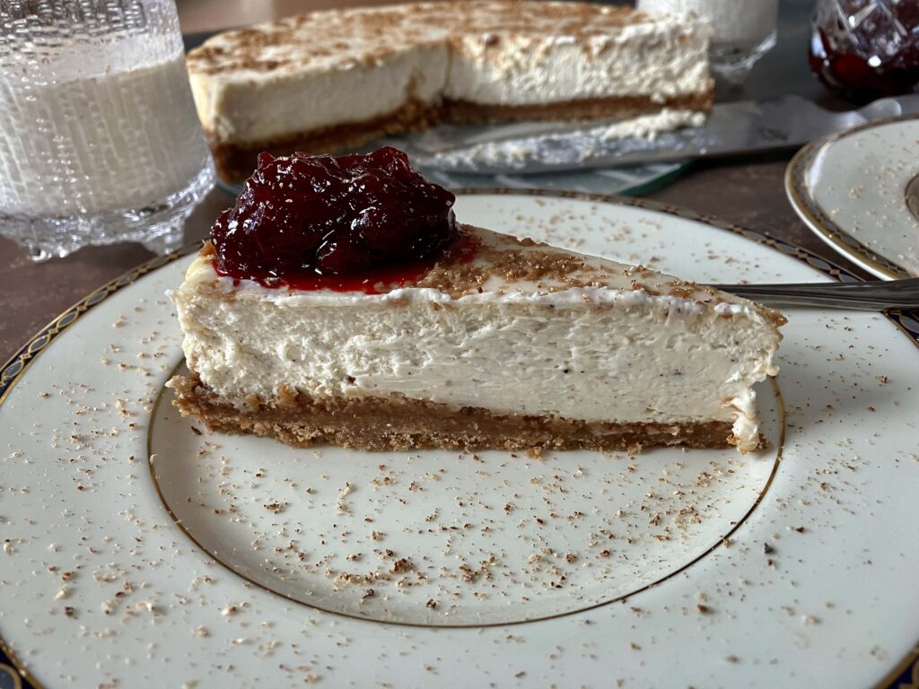 Eggnog Cheesecake with cranberry rum sauce