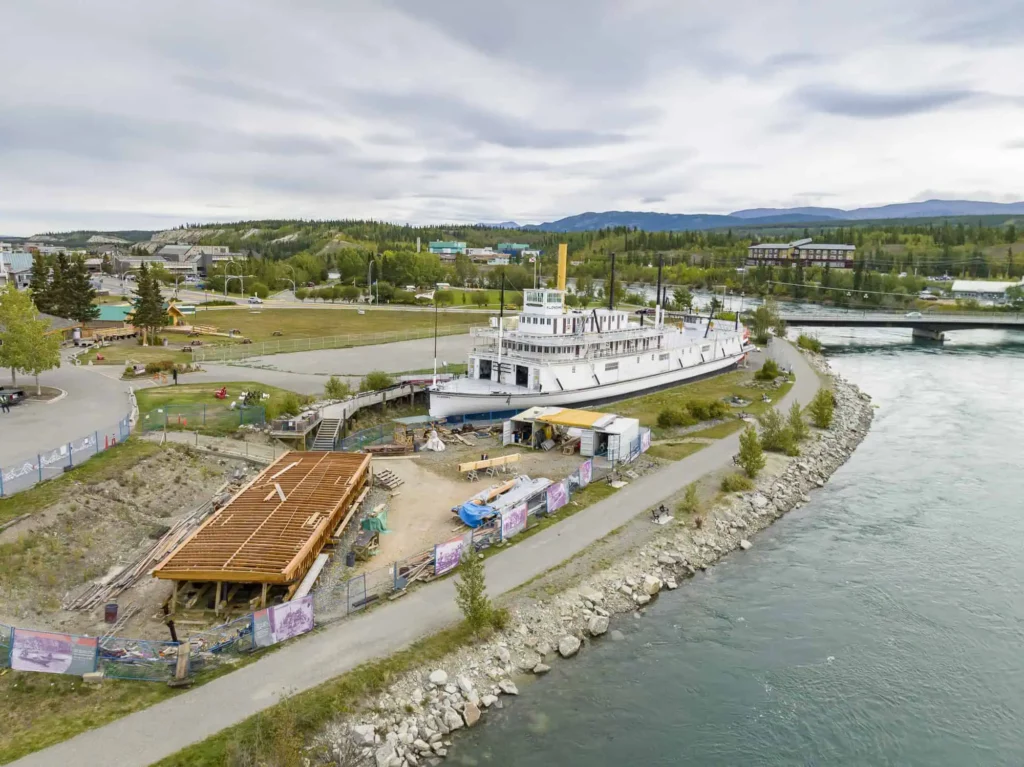 Aerial view of the S.S. Klondike and the Atlin Barge undergoing restoration work in fall of 2023